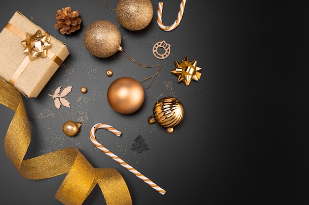 Top view of golden christmas ornaments with copy space