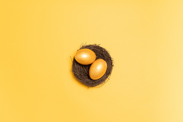 Top view of golden eggs in the nest