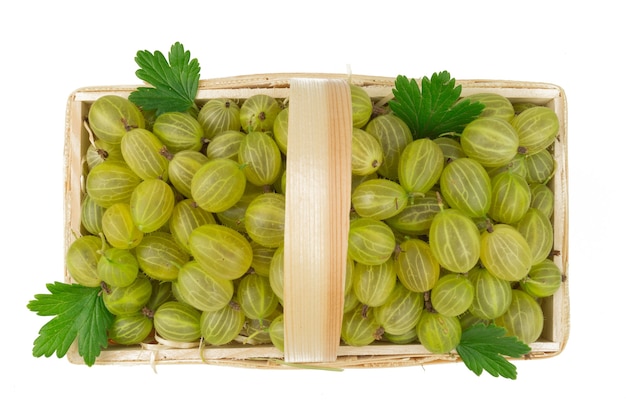 Top view on gooseberry isolated in wooden basket