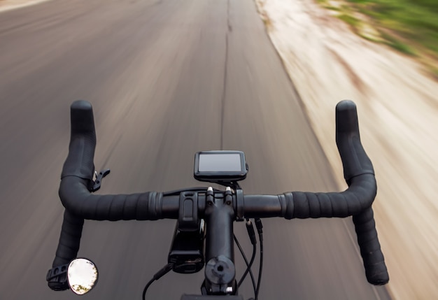 Top view of a gravel bicycle riding on the road with blurred background.