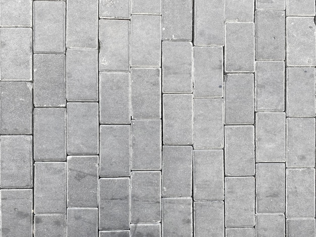 Top view of gray cement blocks path way floor background.