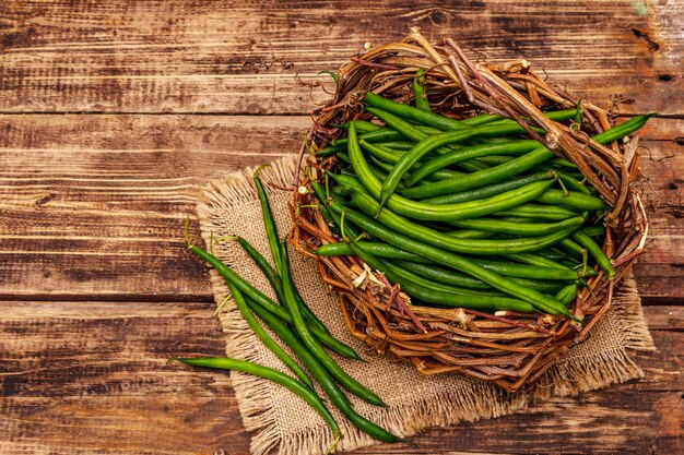 top view green beans in a wicker basket