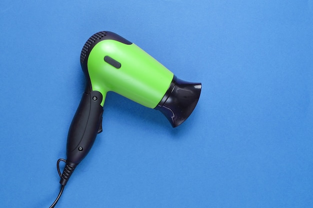 Top view on green hair dryer isolated