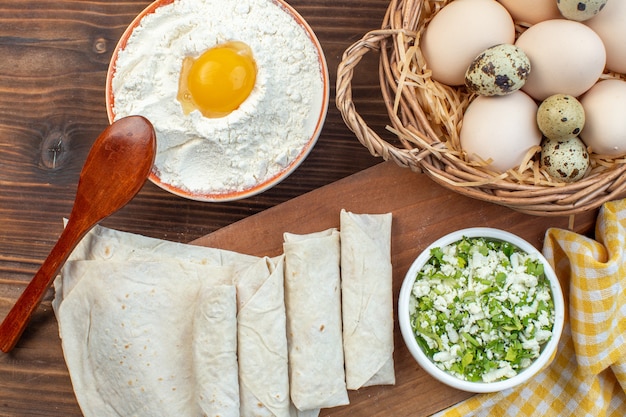 top view greens pita rolls with eggs and flour