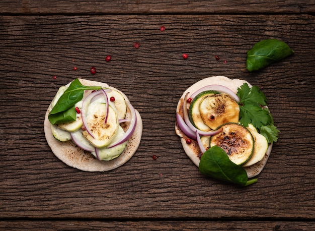 Top view grill naan with zucchini on wood