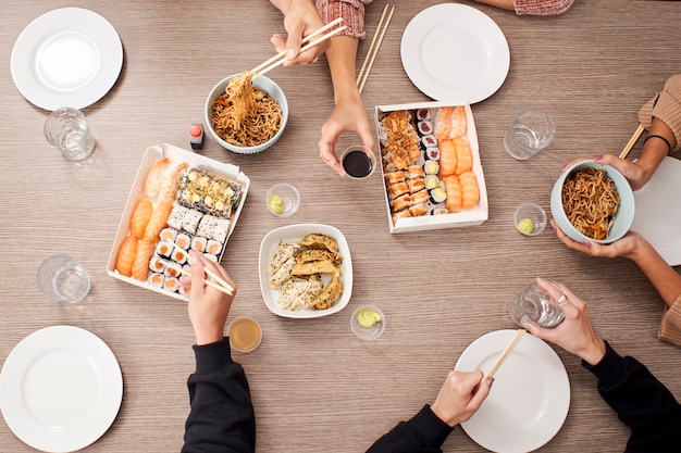 Top view of group of people have eating food of Japanese food