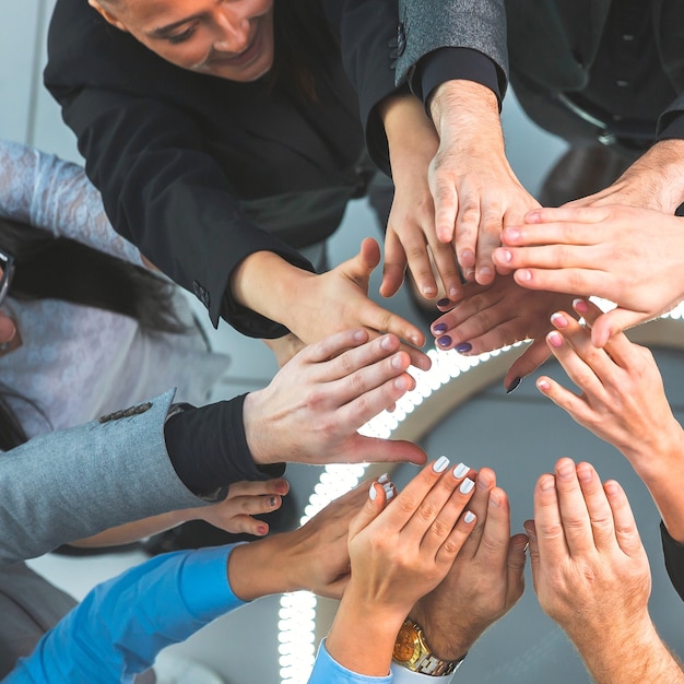 Top view. group of young business people standing in a circle. the concept of teamwork