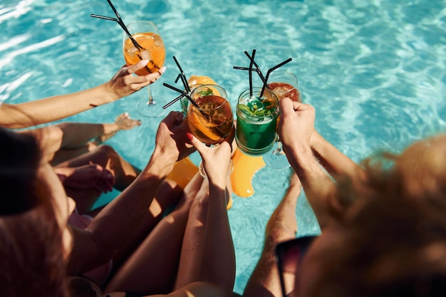 Top view of group of young happy people that have fun in
swimming pool at daytime