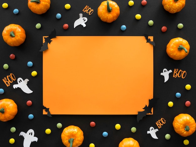 Photo top view halloween concept with pumpkins