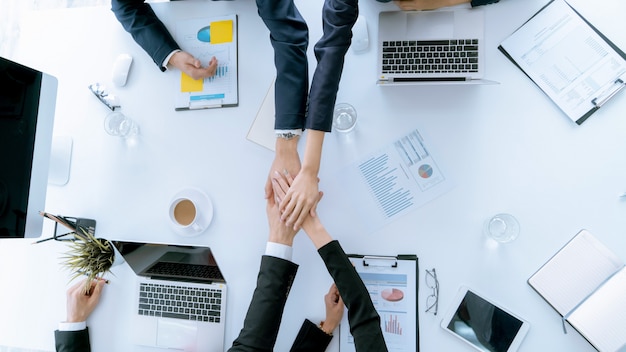 Top view hand of business team during meeting conference are working documents