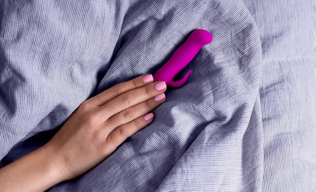 Top view hand holding purple vibrator