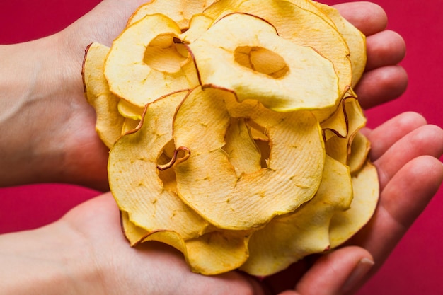 Top view handful of round dried slices of apple