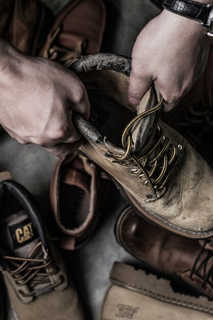 Top view of hands holding a boot