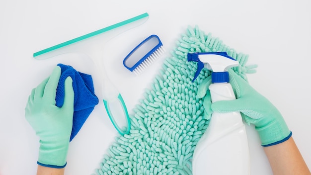 Top view hands holding cleaning equipment