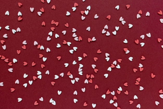 Photo top view on hearts decoration confetti