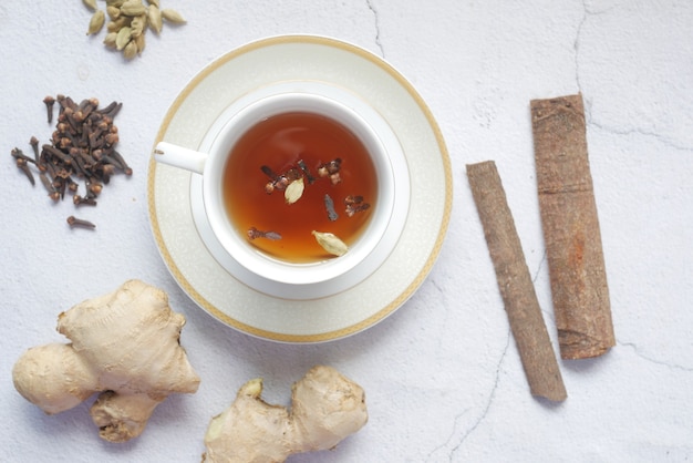 Top view of herbal tea and ingredient on table