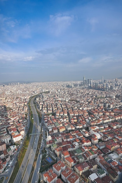 top view of highway road multilevel junction and residential buildings