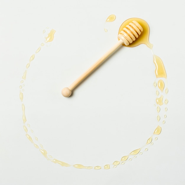 Top view honey circle with spoon