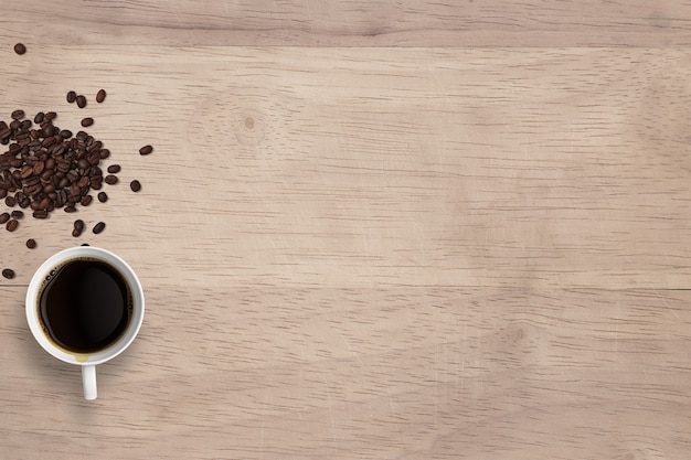 Top view hot black coffee on cups and beans isolated