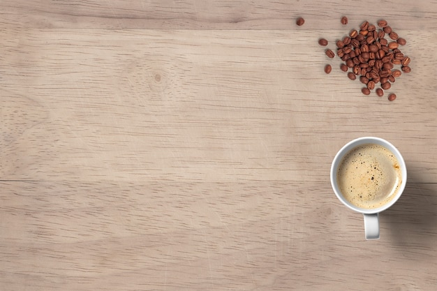 Top view hot coffee cappuccino with beans isolated