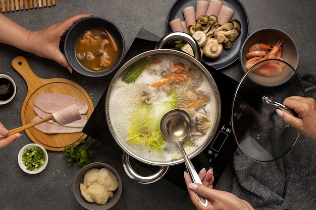 Photo top view over hotpot dishes