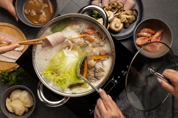 Photo top view over hotpot dishes