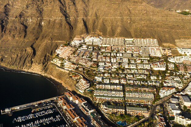 Top view of the houses located on the rock of Los Gigantes at sunset Tenerife Canary Islands Spain