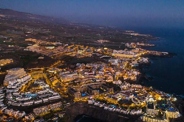 Top view of the houses located on the rock of Los Gigantes at sunset Tenerife Canary Islands Spain