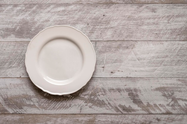 Top view image of white porcelain on gray wooden table