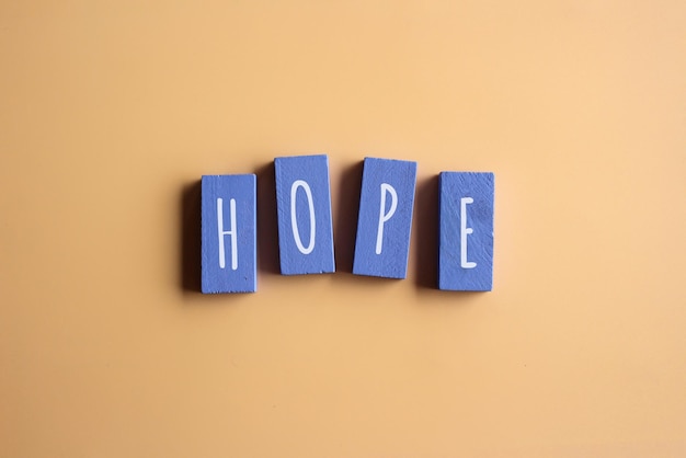 Top view image of wooden cubes with text HOPE