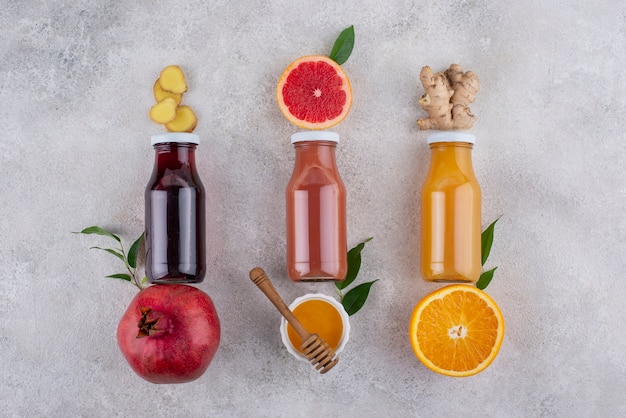 Top view of immunity boosting foods and juice with citrus and ginger