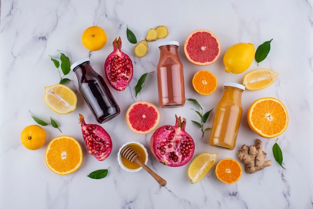 Top view of immunity boosting foods and juice with citrus and ginger