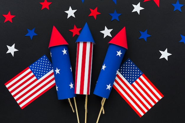 Top view of independence day fireworks with stars and american flags