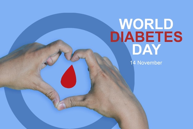 Photo top view inscription world diabetes day and hand gesture with red blood drop in man hands, copyspace