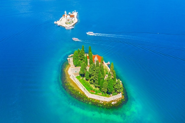 Top view of the island with a monastery and an artificial island in the blue sea