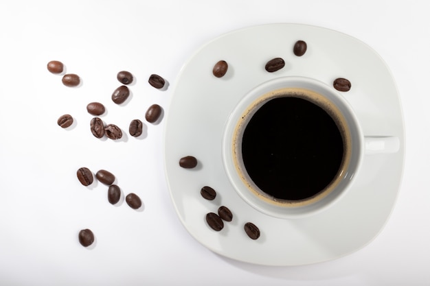 Top view of isolated coffee cup with coffee beans