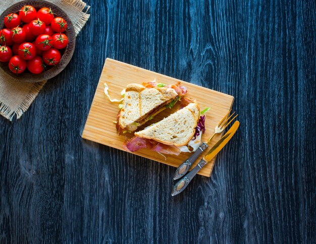 Top view of italian classic pizza margherita over a wooden table with toppings