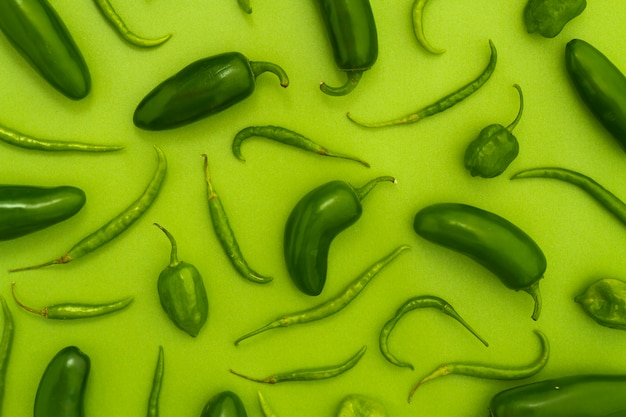 Top view jalapenos with green background