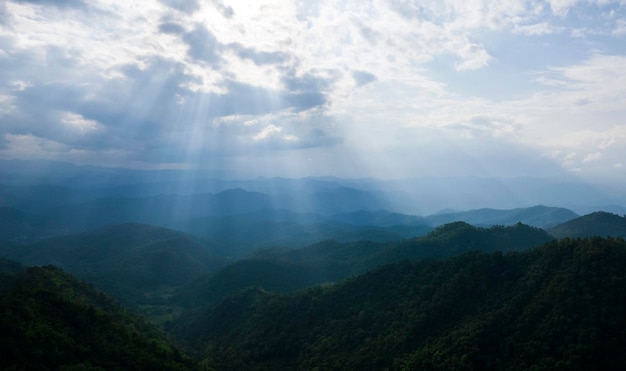 Top view Landscape of Morning Mist with Mountain Layer at north of Thailand mountain ridge and clouds in rural jungle bush forest