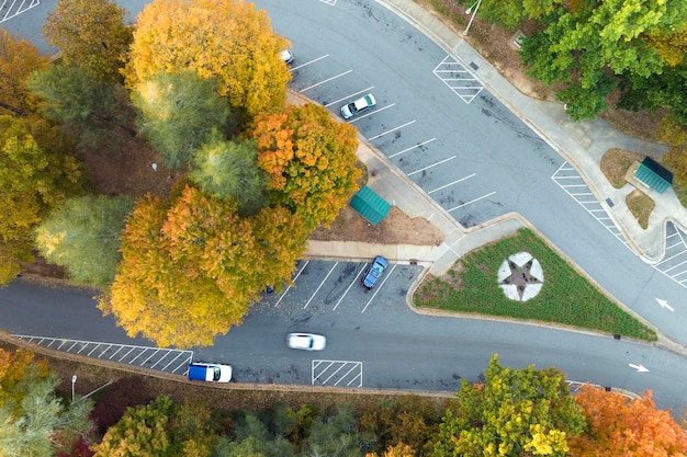 Top view of large rest area near busy multilane american freeway with fast moving cars and trucks Recreational resting place during interstate traveling