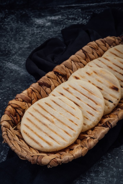 Top view of Latin American arepas on a dark background