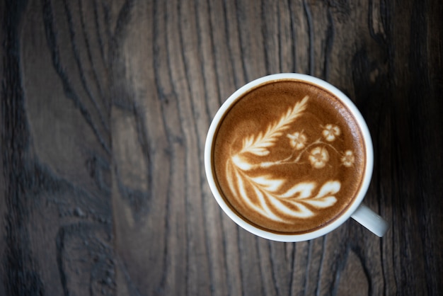 Top view latte art coffee cup.