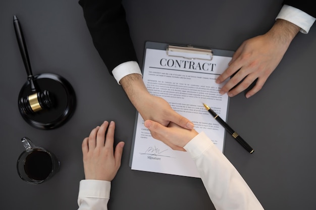 Top view lawyer colleagues or legal team handshake Equilibrium