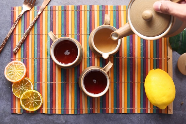 Top view of lemon tea on wooden background.