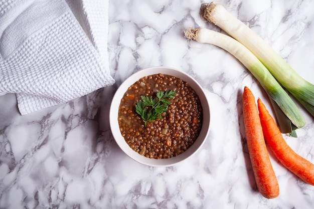 Top view of lentils with carrot and leek