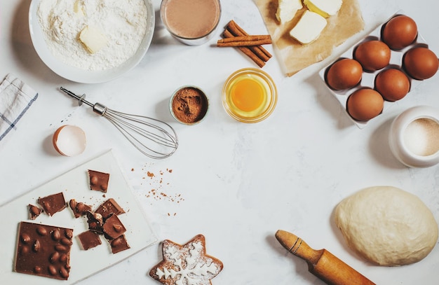 Top view on light background with ingredients for making dough