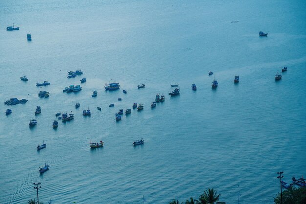 Top view of local fisherman boats in the deep blue sea tropical seascape Travel concept