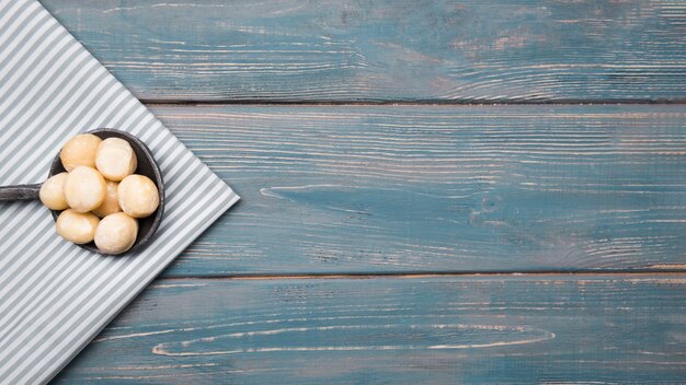 Top view of macadamia nuts with copy space