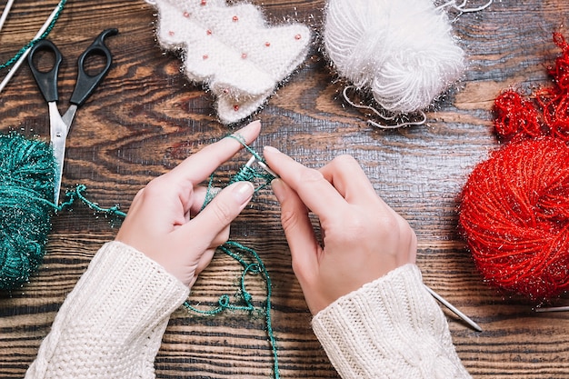 Top view of making handmade knitted gifts for Christmas