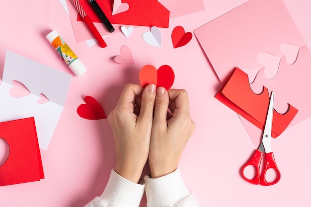 Top view Making of handmade Valentine greeting card from paper